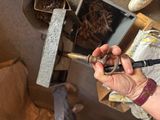a person that is holding a hammer in their hand