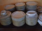 a lot of plates that are sitting on a table