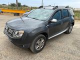 a picture of a dust covered dacia parked in a parking lot