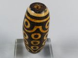 an image of a glass bead on a clear stand