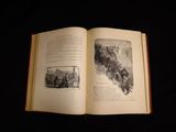 an open book with a picture of a train on it