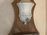 a picture of a wall mounted shelf with a vase on it