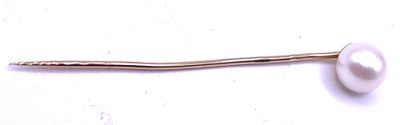 a white pearl on a stick on a white surface