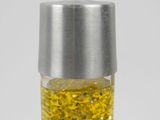 a bottle of liquid with a silver top and a yellow liquid inside