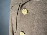 a close up of a coat with buttons on it