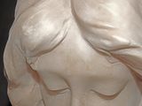 a statue of a woman with her eyes closed