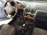 a dashboard of a car with a steering wheel and dashboard controls