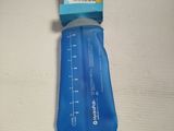a blue plastic water bottle on a white surface