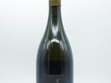 the bottle of wine is empty on a white surface