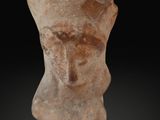 an ancient clay head of a woman