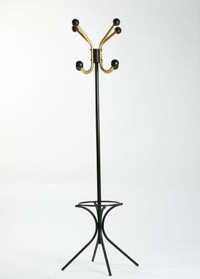 Porte manteau perroquet en métal noirci et doré.