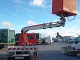 a crane that is sitting in the middle of a parking lot
