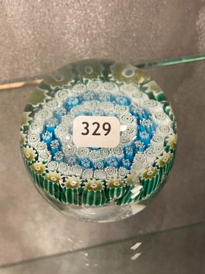 a glass ornament that has a number on it
