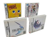 quatre boîtes de jeux vidéo posées les unes à côté des autres