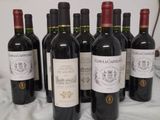 several bottles of wine are lined up on a table