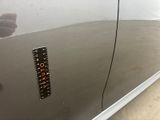a sticker on the door of a silver car