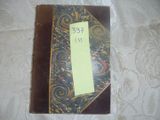 a book with a yellow sticker on it sitting on a table