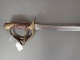 a sword that is on display on the wall