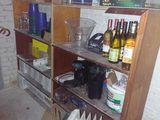 a shelf with many bottles of wine and bottles of wine on it