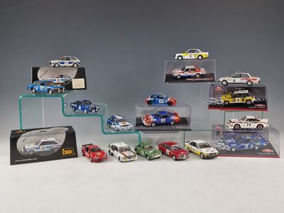 a lot of cars that are on display in a display case