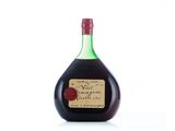 an image of a bottle of wine sitting on top of a white surface