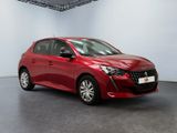 a red car is parked in a white room with a black floor