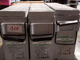 several boxes are stacked on top of each other in a warehouse