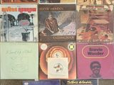 a lot of records on the floor of a room