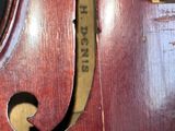 a close up of the back of a violin