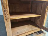 a wooden cabinet with two drawers and a mirror