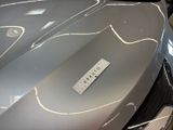 a close up of a car with a name tag on it