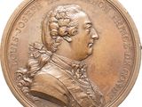 an image of a bronze medal with a portrait of a man on it