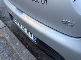 a silver car parked on the side of the street