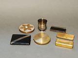 a lot of gold and silver items sitting on a table