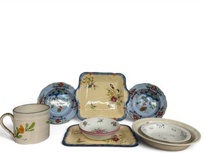 many different types of dishes and cups on the table
