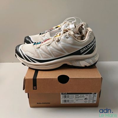 a pair of shoes that are on top of a box