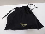 a black bag with a logo on it sitting on a table