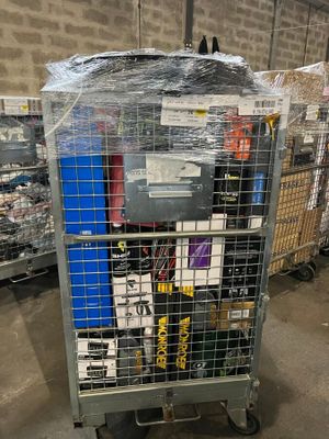 a cart with a bunch of items in it in a warehouse