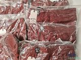 a pile of red underwear wrapped in plastic bags