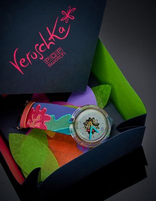 a box with a watch inside of it that has a picture of a woman on it
