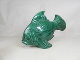 green ceramic fish figurine on a white background