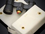 a pair of binoculars that are sitting on top of a bag