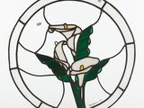 a stained glass picture of a flower in a circle