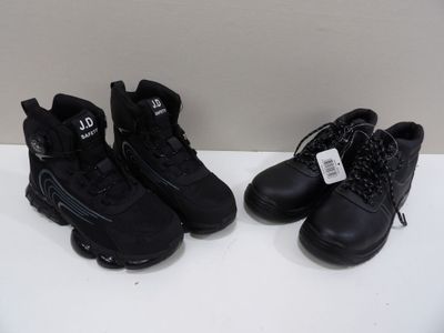 two pairs of black running shoes are on a white surface