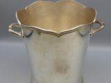 an antique silver plated ice bucket with handles and handles