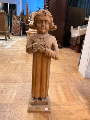 a statue of a woman that is on display in a room