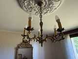 a chandelier hanging from the ceiling in a room