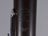 an image of a close up of a bassoon with a silver handle