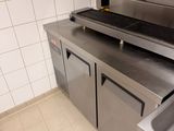 a kitchen with a sink and a stove in it