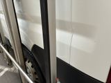 a close up of a door handle on a bus